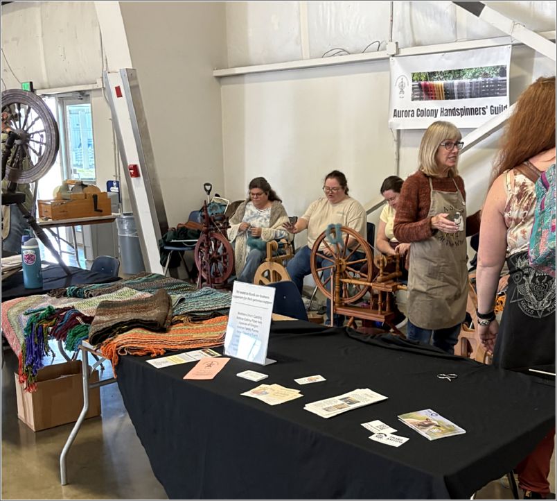  The Aurora Colony Handspinners Guilds booth. Photo: Linda Bolewicz.
